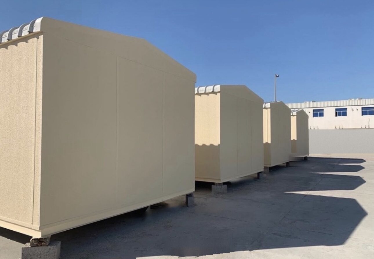 Row of new gypsum board cabins ready for a site camp
